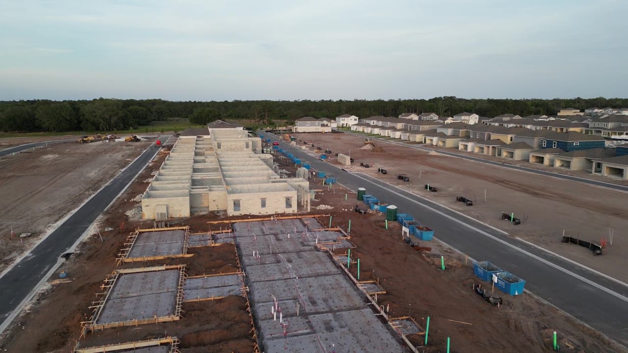 Construction-site survey — earthworks, foundations, and progress.