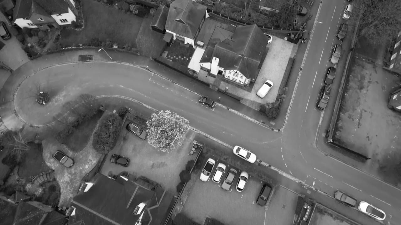 Urban overwatch — streets, access routes, and parking density.